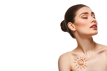 Image showing girl with sun drawing on forehead isolated on white