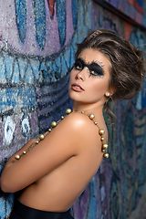 Image showing beautiful young woman with dark smoky eyes