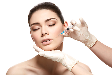 Image showing girl getting face injection isolated on white