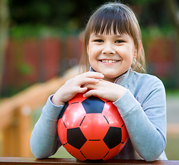 Image showing Cute little girl is playing in playground