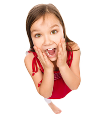 Image showing Little girl is holding her face in astonishment