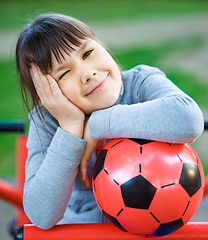 Image showing Cute little girl is playing in playground