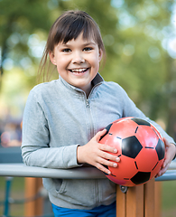 Image showing Cute little girl is playing in playground