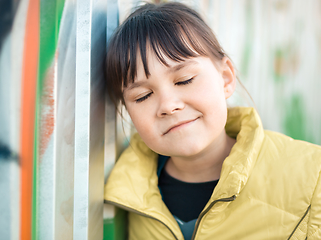 Image showing Cute little girl is playing in playground