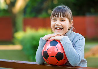 Image showing Cute little girl is playing in playground