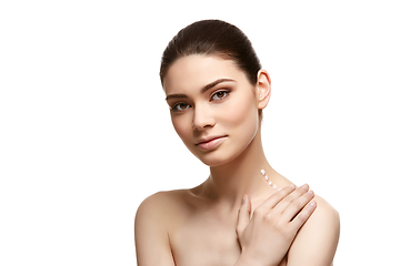 Image showing girl applying moisturizing cream isolated on white