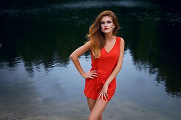 Image showing beautiful girl wiith red lips near lake