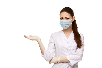 Image showing woman doctor in mask isolated on white