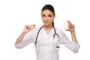 Image showing woman doctor with pills isolated on white