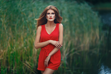 Image showing beautiful girl wiith red lips near lake