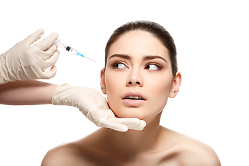 Image showing girl getting face injection isolated on white