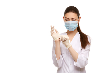 Image showing woman doctor in rubber gloves isolated on white