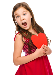 Image showing Little girl is holding red heart