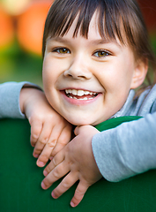 Image showing Cute little girl is playing in playground