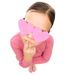 Image showing Little girl with hearts over her eyes