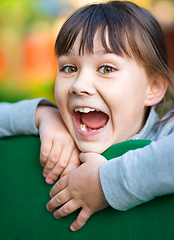 Image showing Cute little girl is playing in playground