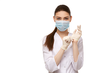 Image showing woman doctor in rubber gloves isolated on white