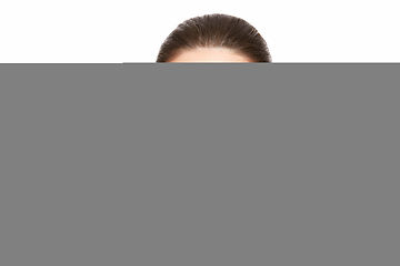 Image showing girl applying eyelash mascara isolated on white