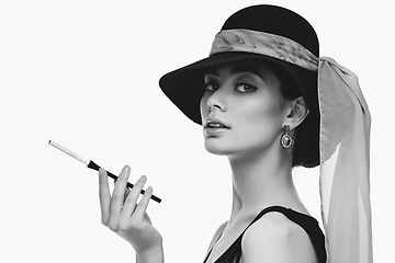 Image showing beautiful young woman in retro style with cigarette