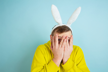 Image showing Easter bunny man with bright emotions on blue studio background