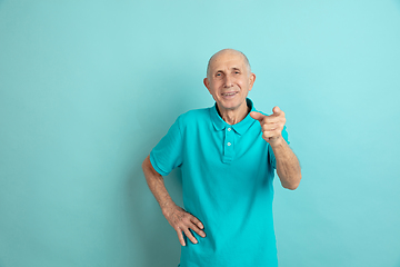 Image showing Caucasian senior man\'s portrait isolated on blue studio background