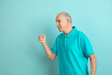 Image showing Caucasian senior man\'s portrait isolated on blue studio background