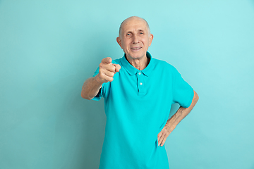 Image showing Caucasian senior man\'s portrait isolated on blue studio background