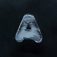 Image showing Alphabet\'s letters made out of ice isolated on dark studio background