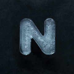 Image showing Alphabet\'s letters made out of ice isolated on dark studio background