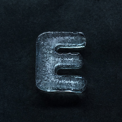 Image showing Alphabet\'s letters made out of ice isolated on dark studio background