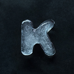 Image showing Alphabet\'s letters made out of ice isolated on dark studio background