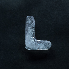 Image showing Alphabet\'s letters made out of ice isolated on dark studio background