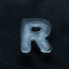 Image showing Alphabet\'s letters made out of ice isolated on dark studio background