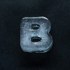 Image showing Alphabet\'s letters made out of ice isolated on dark studio background