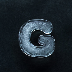 Image showing Alphabet\'s letters made out of ice isolated on dark studio background