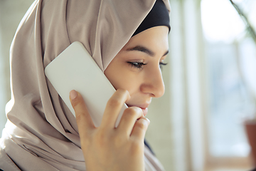 Image showing Portrait of a beautiful arabian businesswoman wearing hijab while working