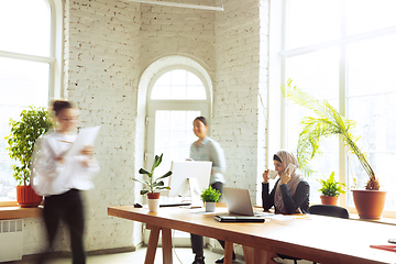 Image showing Portrait of a beautiful arabian businesswoman wearing hijab while working