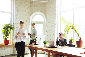 Image showing Portrait of a beautiful arabian businesswoman wearing hijab while working