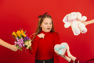 Image showing Valentine\'s day celebration, happy caucasian girl isolated on red background