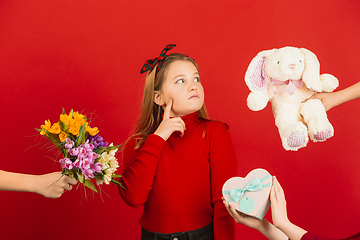 Image showing Valentine\'s day celebration, happy caucasian girl isolated on red background