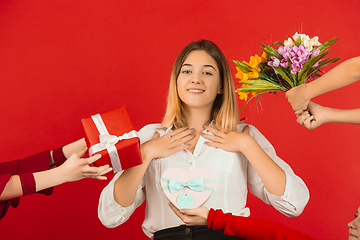 Image showing Valentine\'s day celebration, happy caucasian girl isolated on red background