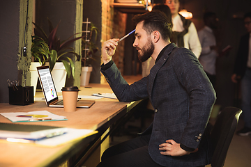 Image showing Colleagues working together in modern office using devices and gadgets during creative meeting