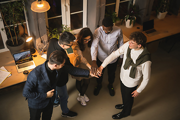 Image showing Colleagues working together in modern office using devices and gadgets during creative meeting