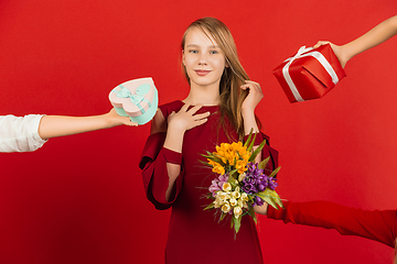 Image showing Valentine\'s day celebration, happy caucasian girl isolated on red background