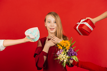 Image showing Valentine\'s day celebration, happy caucasian girl isolated on red background