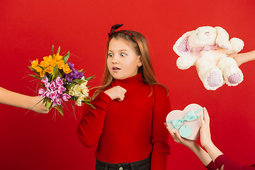 Image showing Valentine\'s day celebration, happy caucasian girl isolated on red background