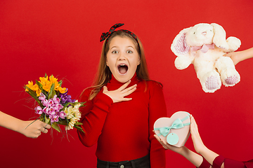 Image showing Valentine\'s day celebration, happy caucasian girl isolated on red background