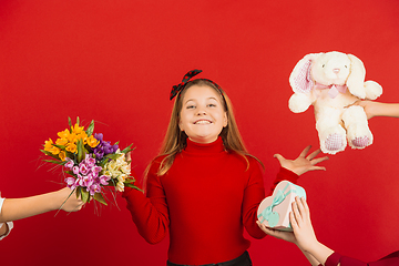 Image showing Valentine\'s day celebration, happy caucasian girl isolated on red background