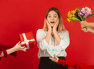 Image showing Valentine\'s day celebration, happy caucasian girl isolated on red background