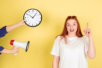 Image showing Caucasian young woman\'s portrait on yellow background, too much tasks